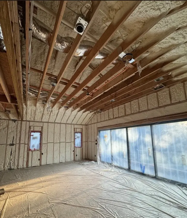 Interior walls and ceiling insulated with spray foam during new construction in Fairbanks